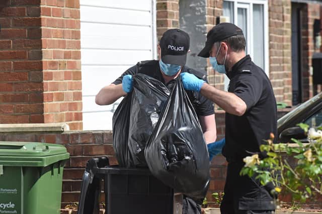 Pictured:  Police search the front garden and bins at the property on All Saints Road, Buckland, on May 12 following the arrest of three women. Picture: Simon Czapp/Solent News & Photo Agency