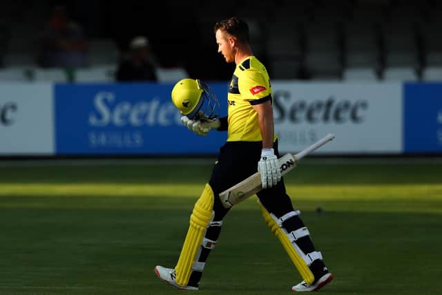 Hampshire's D'Arcy Short exits the pitch looking dejected after being caught out at Chelmsford. Photo by Jacques Feeney/Getty Images.