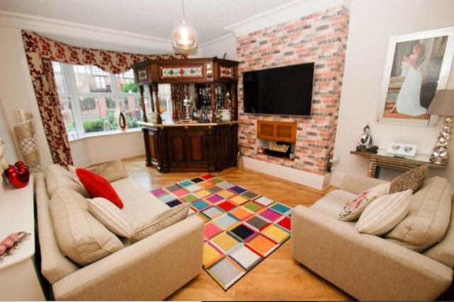 The welcoming living room which features its own bar area. 
Image by Andrew Craig.