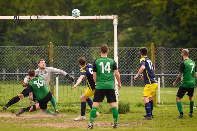 Action from Saturn Royale's 1-0 win over Pelham Arms (blue and yellow kit) in the second Adelaide Cup semi-final. Picture: Keith Woodland (300421-1074)