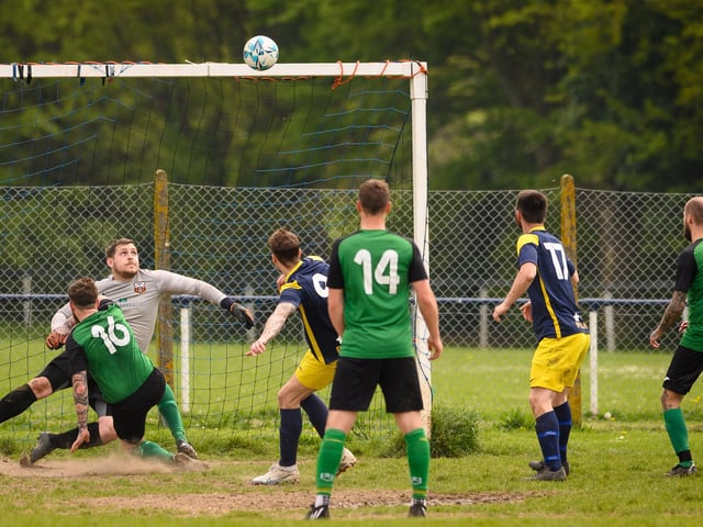 Action from Saturn Royale's 1-0 win over Pelham Arms (blue and yellow kit) in the second Adelaide Cup semi-final. Picture: Keith Woodland (300421-1074)