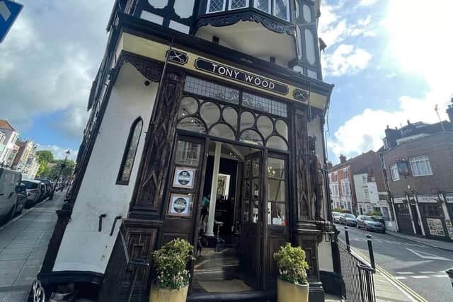Outside Tony Wood Hair showing the missing statue. Picture: Tony Wood Hair
