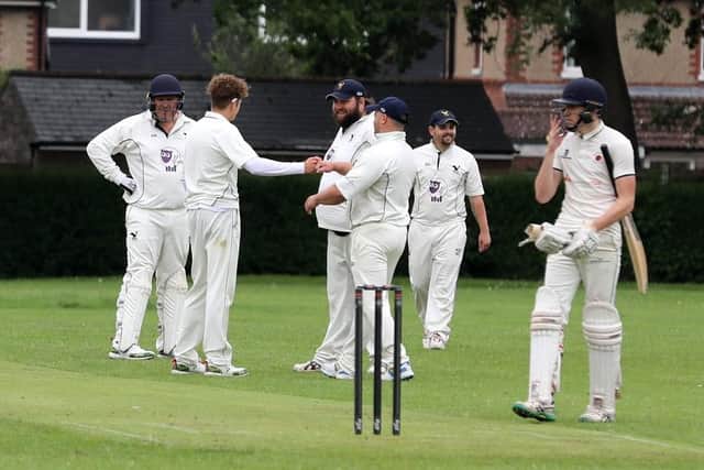 Purbrook 2nds celebrate the dismissal of Waterlooville 2nds captain Jake Charman. Picture: Sam Stephenson