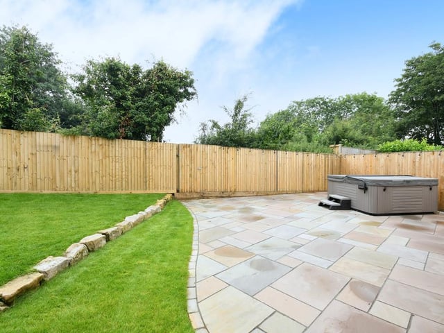 Externally the property has a large, south facing rear garden laid mainly to lawn with two paved patio areas perfect for outdoor entertaining.