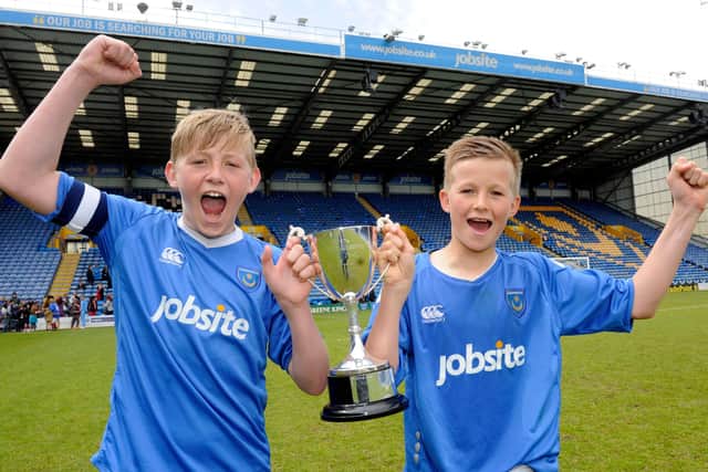 Tommy Leigh, right, with Priory School team-mate Harvey Tanner after they won the U-13 Schools' Cup at Fratton Park in 2013. Picture: Ian Hargreaves