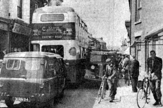 Bit of a squeeze. In April 1960, a bus and a lorry became jammed in narrow Arundel Street, Landport. Picture: The News archive.