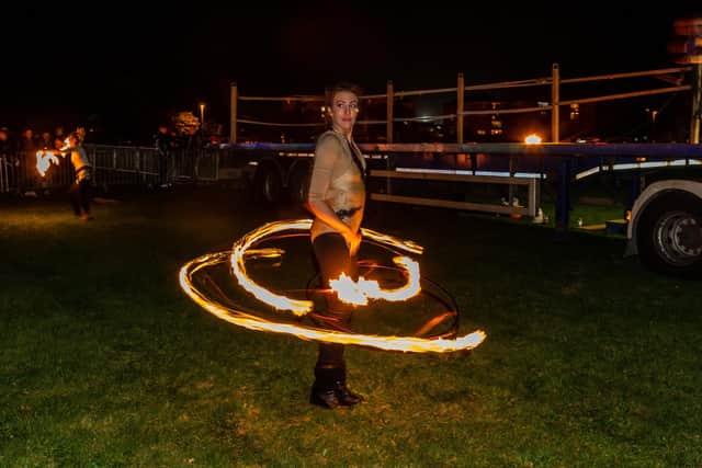 Jess Bee, hoop dancer from Ethereal Performance, entertaining the crowds waiting for the fireworks. Picture: Mike Cooter (281021)