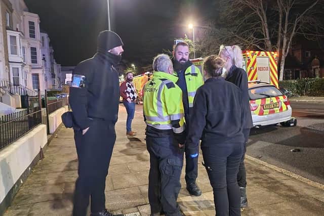 Janus Security Services Ltd staff stopped at the scene to assist emergency service crews. Picture: Russell White