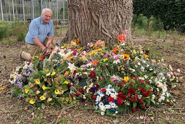 Councillor Gerald Vernon-Jackson, with some of the floral tributes. He said: 'It was wonderful to see the flowers that had been laid on the Guildhall steps by residents and visitors in tribute to the Queen. These will now be composted, and the compost used when we plant a tree to remember the Queen, which will be fed with the best wishes of all who laid flowers.'