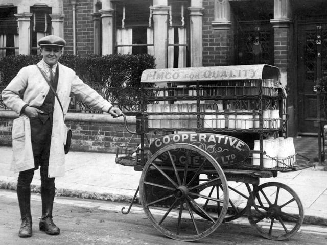 Milkman Len Garland taken in Froddington Road, Fratton.Len Garland in 1926 with his push along milk float. I am told he  went back to the dairy twice on his round to complete his deliveries. he is of course, working for the Portsea Island Mutual Co-op which was very big in Portsmouth in more ways than just milk. There also seems to be half-pint bottles of milk as well. Picture: Costen.co.uk