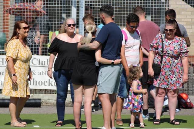 Mr Lynch embracing Ms Darby at the football tournament on Sunday, August 7. Picture: Darren Darby.