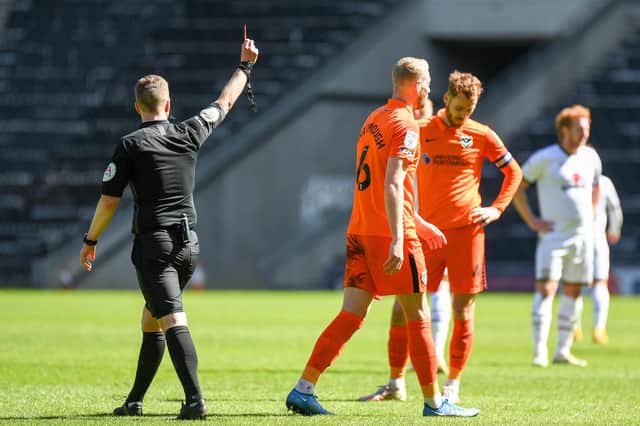 Portsmouth FC defender Jack Whatmough (6)shown a red card, sent off during the EFL Sky Bet League 1 match between Milton Keynes Dons and Portsmouth at stadium:mk, Milton Keynes, England on 17 April 2021.