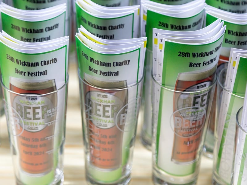 Souvenir glasses at the Wickham Beer Festival. Picture: Mike Cooter (060424)