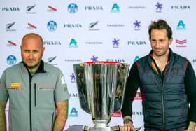 Team Ineos skipper Sir Ben Ainslie, right, with Luna Rossa team director Max Sirena with the Prada Cup at a press conference this week. Photo by Gilles Martin-Raget / AFP via Getty Images.