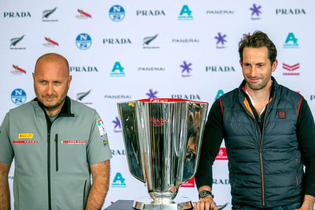 Team Ineos skipper Sir Ben Ainslie, right, with Luna Rossa team director Max Sirena with the Prada Cup at a press conference this week. Photo by Gilles Martin-Raget / AFP via Getty Images.