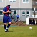 Jack Chandler covers his face after seeing his penalty saved by Binfield's Chris Grace. Picture: Tom Phillips.