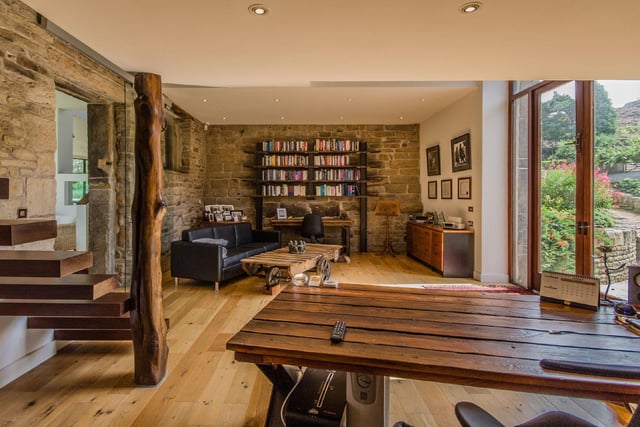 A cosy office space sits in the west wing of the original barn, which is flooded by an abundance of natural light from the arched windows and boasts views over the courtyard.