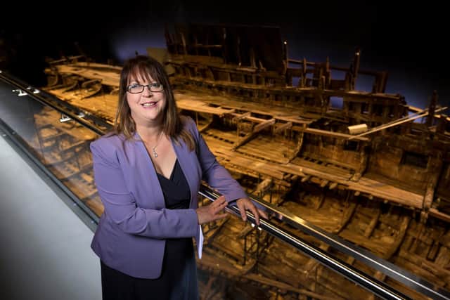 Helen Bonser-Wilton, chief executive of The Mary Rose Trust in Portsmouth, with the ship in the background. Picture: Christopher Ison