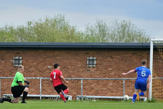 Connor Johnson scores one of his two goals for Locks Heath against Silchester. Picture: Andrew Ormerod.