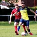 Dec Seiden (yellow) on the ball for Moneyfields at  Locks Heath. Picture by Tom Phillips