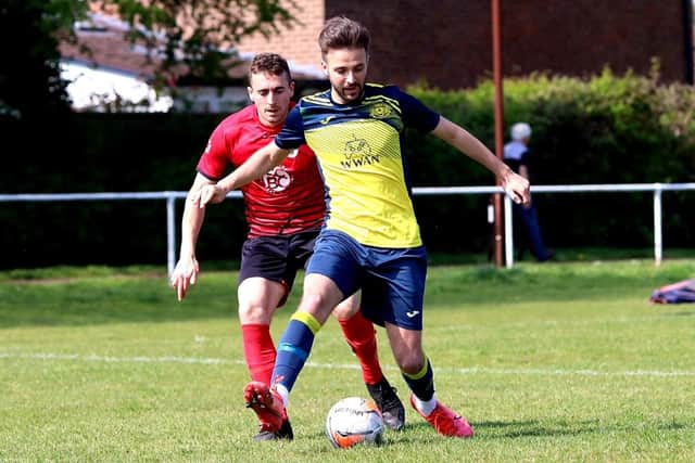 Dec Seiden (yellow) on the ball for Moneyfields at  Locks Heath. Picture by Tom Phillips