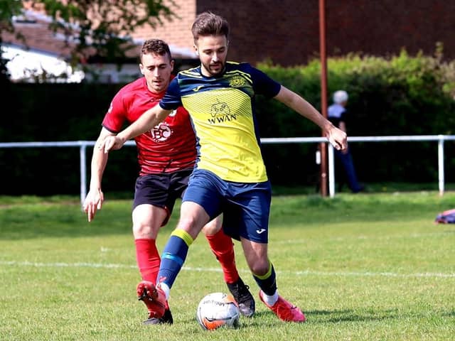 Dec Seiden (yellow) on the ball for Moneyfields at  Locks Heath. Picture by Tom Phillips