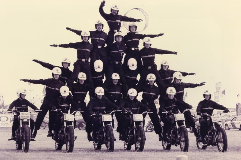 On six motorbikes, the ever impressive Royal Signals White Helmets motorcycle display team in action at the Southsea Show, 1993. The News PP5210