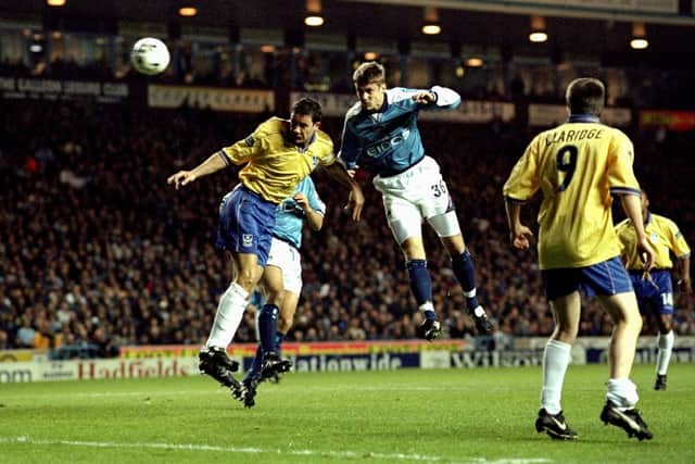 Pompey's Adrian Whitbread challenges Manchester City's Danny Granville at Maine Road in November 1999. Picture: Michael Steele/Allsport
