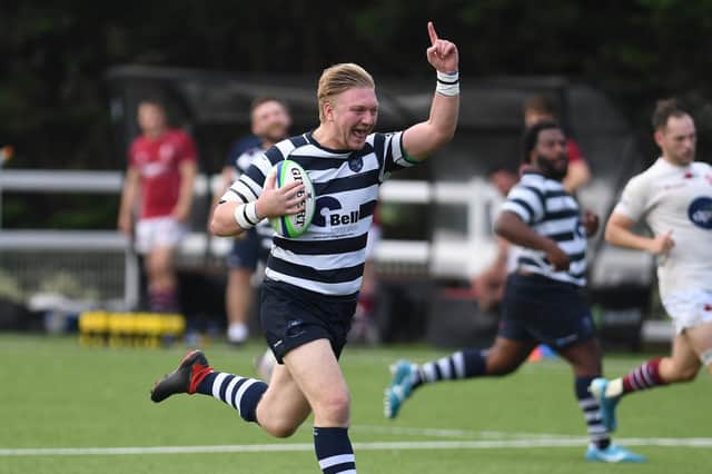 Jacob Knight points skywards as he heads over for a debut try. Picture: Neil Marshall