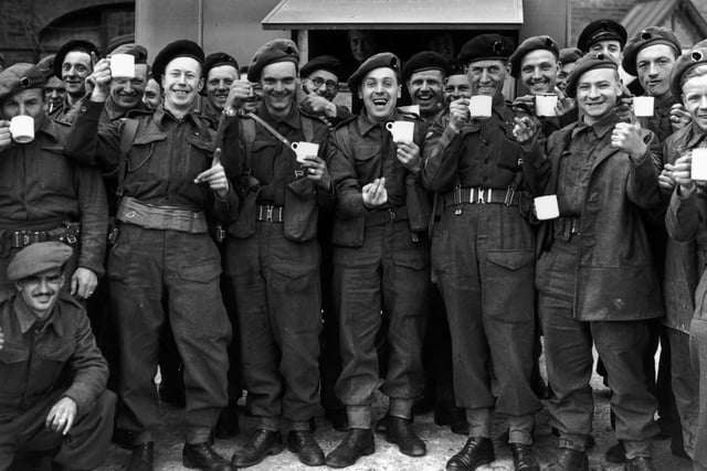 14th June 1944:  British army reinforcements enjoying a cup of tea before leaving for France.  (Photo by Reg Speller/Fox Photos/Hulton Archive/Getty Images)