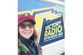 Loree Westron, founder of Portsmouth Authors Collective, outside Victory Radio studios