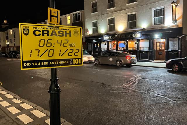 A police sign appealing for witnesses after a collision that led to the death of a 91-year-old woman in Old Portsmouth.