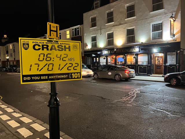 A police sign appealing for witnesses after a collision that led to the death of a 91-year-old woman in Old Portsmouth.