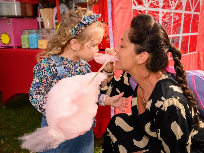 Pictured is: Florence and Louise Traviss enjoy some candy flossPicture: Keith Woodland (300921-19)