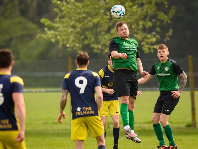 Action from Saturn Royale's 1-0 win over Pelham Arms (blue and yellow kit) in the second Adelaide Cup semi-final. Picture: Keith Woodland (300421-655)