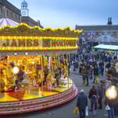 Victorian Fairground ride at dusk Victorian Festival of Christmas Portsmouth Historic Dockyard in previous years.