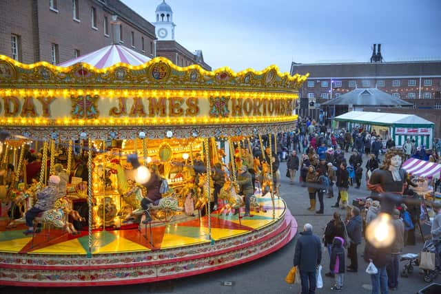 Victorian Fairground ride at dusk Victorian Festival of Christmas Portsmouth Historic Dockyard in previous years.