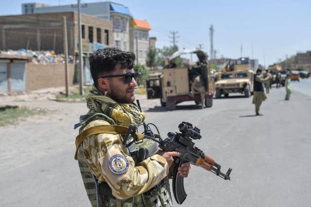 An Afghan National Army commando stands guard along the road in Enjil district of Herat province on August 1, 2021, as skirmishes between Afghan National Army and Taliban continues. Picture: Hoshang Hashimi/AFP via Getty Images