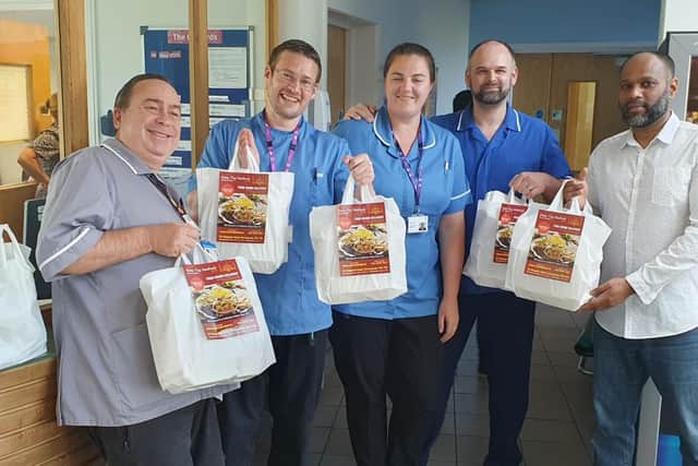 New Taj Mahal Indian takeaway in Buckland donated Iftar meals to Portsmouth hospitals as part of their charitable giving for Ramadan and to give thanks to key workers. Pictured: Salim Miah with medical staff at the Orchards mental health unit at St James' Hospital