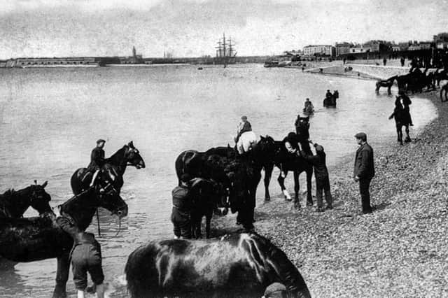 A morning dip on Southsea beach, circa 1910..