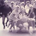 Weapons Engineering Mechanics from HMS Collingwood take charge with a charity bed push from Wykeham day Hospital to Fareham, 1993. The News PP5532