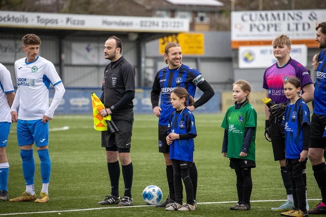 Players line up before kick off. Picture by Alex Shute