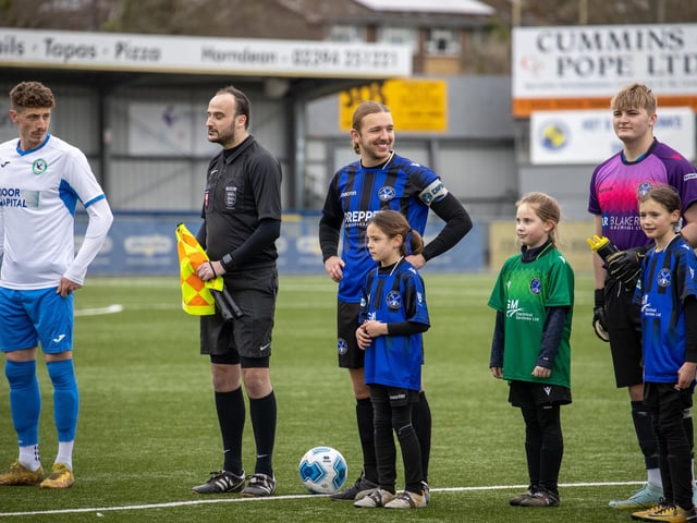 Players line up before kick off. Picture by Alex Shute