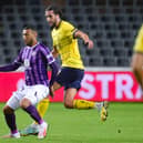 Christian Burgess battles with Toulouse's Yanis Begraoui in Europa League action last month. Picture: VIRGINIE LEFOUR/BELGA/AFP via Getty Images