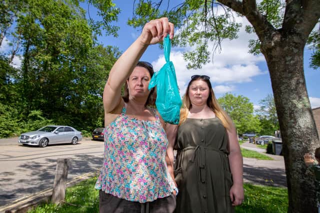 Pictured: Lisa Boyd and Louise Browne with the mysterious substance in a bag outside their home in Waterlooville on 8 June 2021

Picture: Habibur Rahman