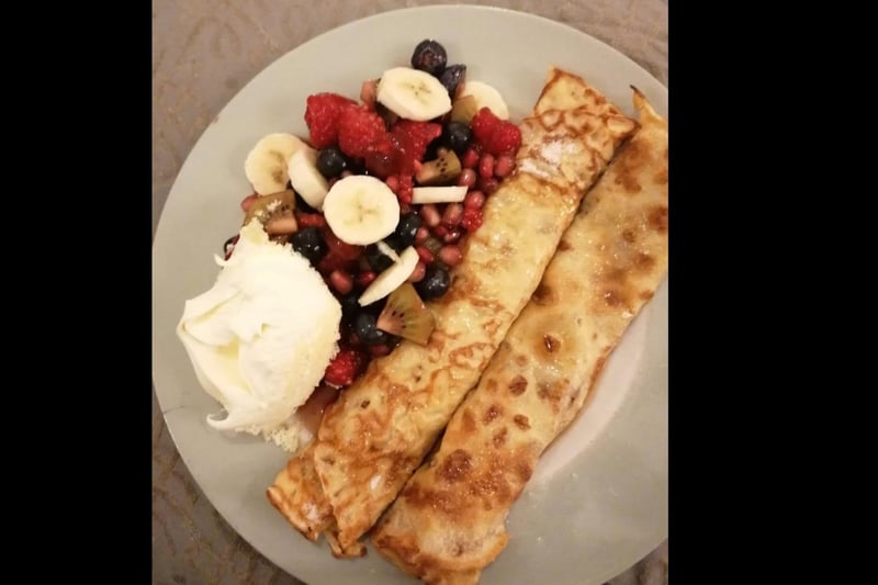 Chocolate and salted caramel filling covered in maple syrup, with raspberries, pomegranate, kiwi, blueberries and banana in raspberry compote with clotted cream. Wow!