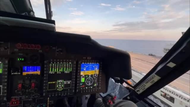 A screenshot from the video showing a pilot landing a US Coastguard helicopter on HMS Prince of Wales. Picture: UK Military & Defence Staff in US.