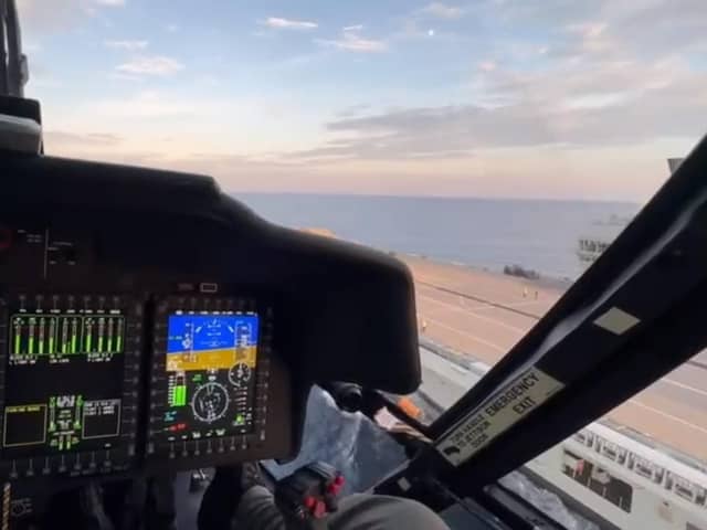 A screenshot from the video showing a pilot landing a US Coastguard helicopter on HMS Prince of Wales. Picture: UK Military & Defence Staff in US.