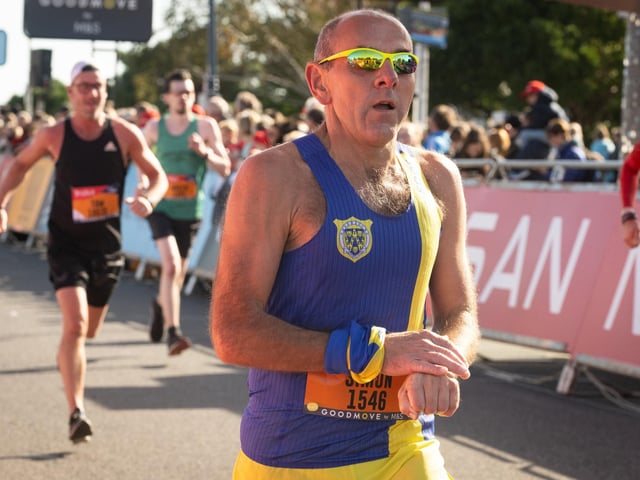 Pictured is: Runners cross the line to finish
Picture: Keith Woodland (151021-634)