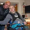 Charlie Stapleford, 20, at home with Grandad Mark Westrope after having his place at St Vincent College revoked following the council being unable to provide transport. Picture: Alex Shute